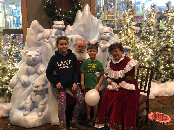The kids with Santa and Mrs. Claus