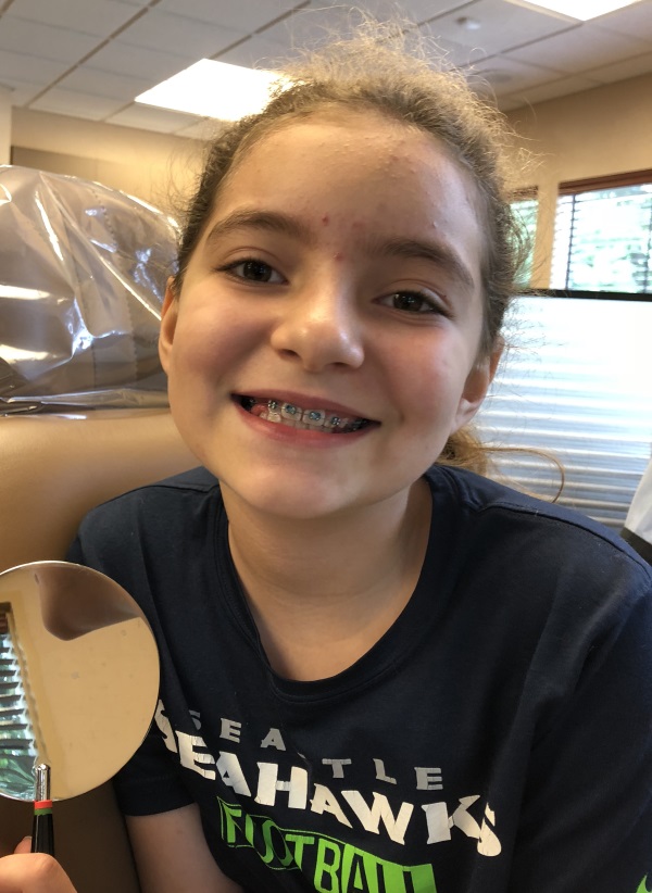 Marisol showing her new braces