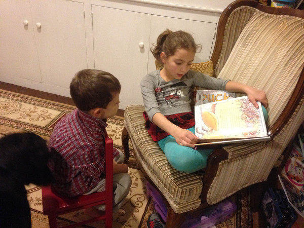 Marisol reading to Cody